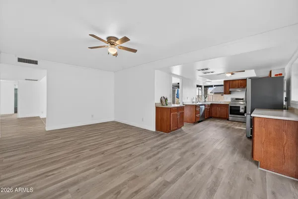 a view of kitchen with furniture and wooden floor