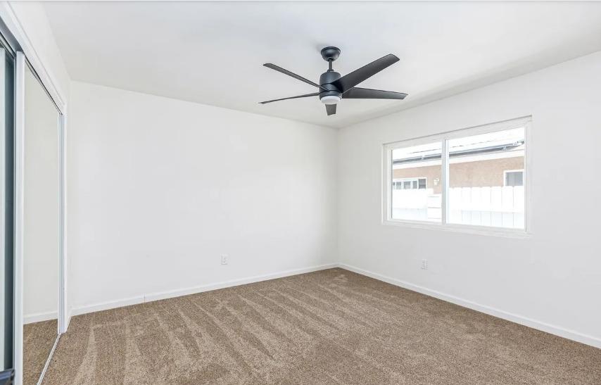 635 Paraiso Avenue Spring Valley, CA 91977 - Photo 13 of 27 an empty room with a window and a fan