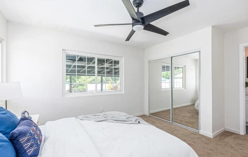 635 Paraiso Avenue Spring Valley, CA 91977 - Photo 14 of 27 a bedroom with a bed and a window