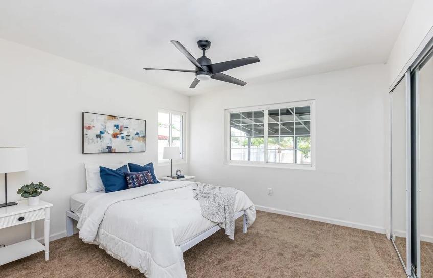 635 Paraiso Avenue Spring Valley, CA 91977 - Photo 15 of 27 a bedroom with a bed and a window