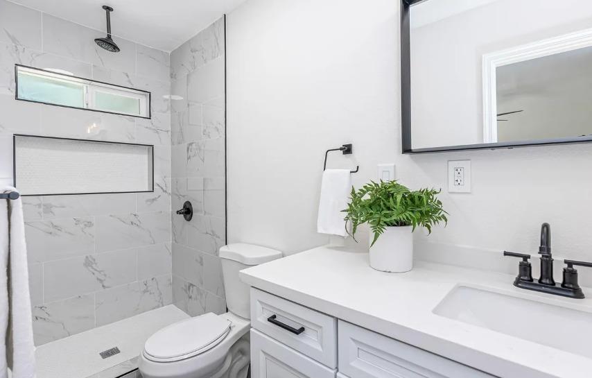 635 Paraiso Avenue Spring Valley, CA 91977 - Photo 16 of 27 a bathroom with a sink a toilet and shower