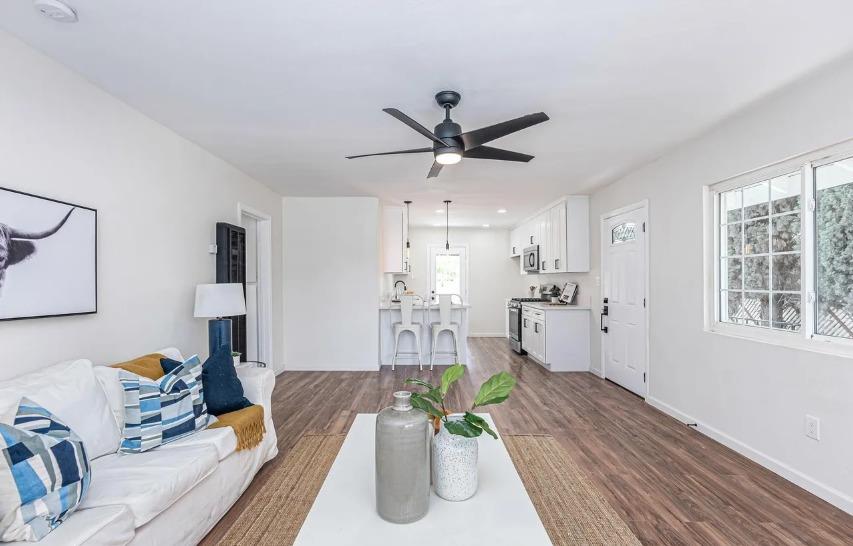 635 Paraiso Avenue Spring Valley, CA 91977 - Photo 18 of 27 a living room with furniture and a wooden floor