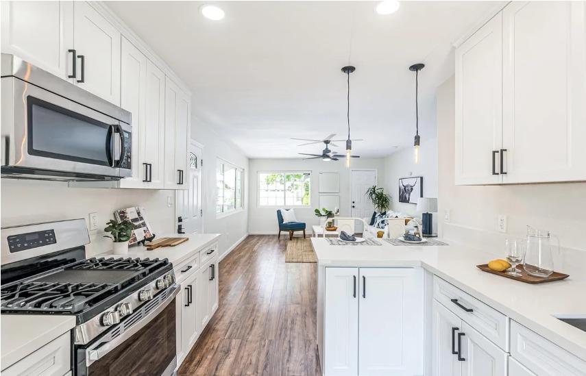 635 Paraiso Avenue Spring Valley, CA 91977 - Photo 27 of 27 a kitchen with sink stove and cabinets