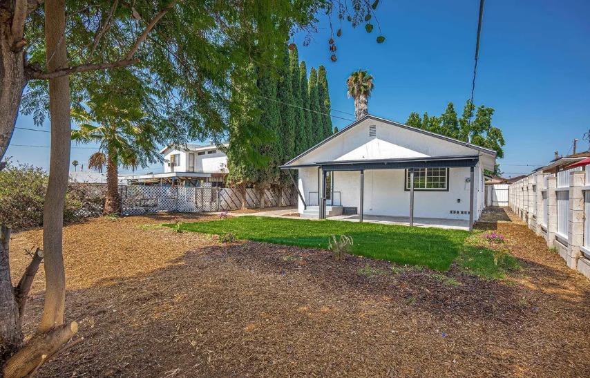 635 Paraiso Avenue Spring Valley, CA 91977 - Photo 9 of 27 a view of a house with a yard and tree s