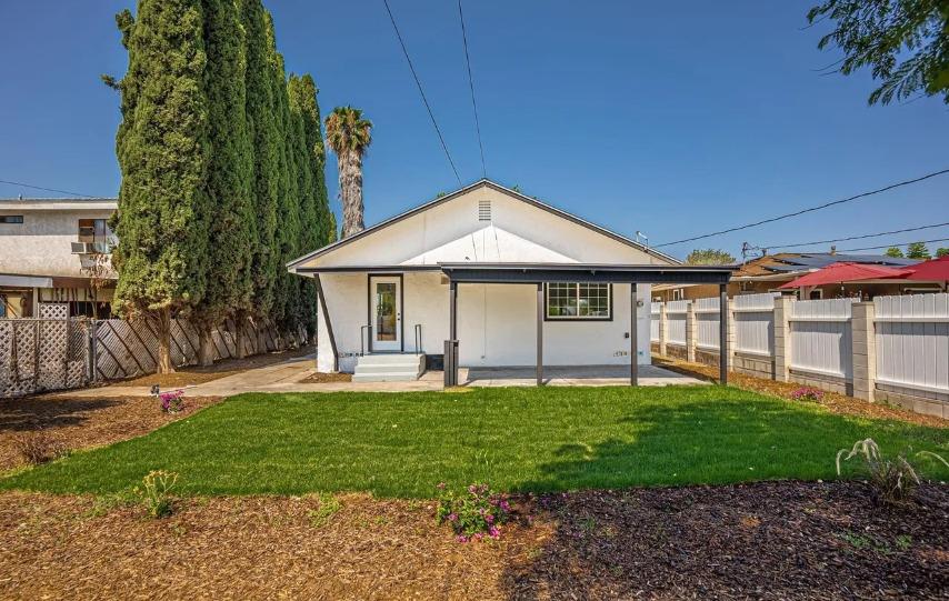 635 Paraiso Avenue Spring Valley, CA 91977 - Photo 10 of 27 a front view of a house with a yard and porch
