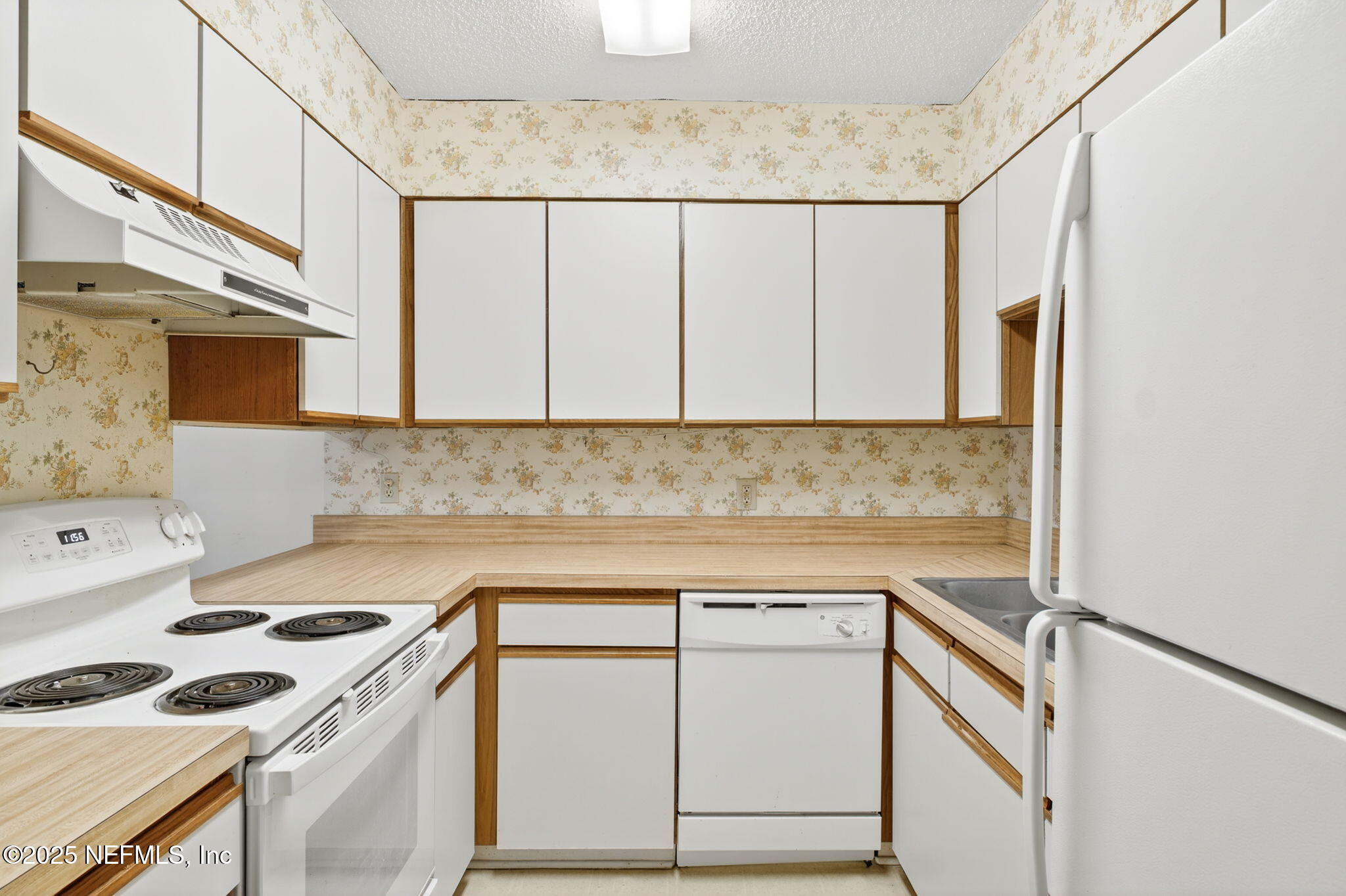 1071 Edgewood Avenue South, Unit 409 Jacksonville, FL 32205 - Photo 11 of 39 a kitchen with a sink cabinets and appliances