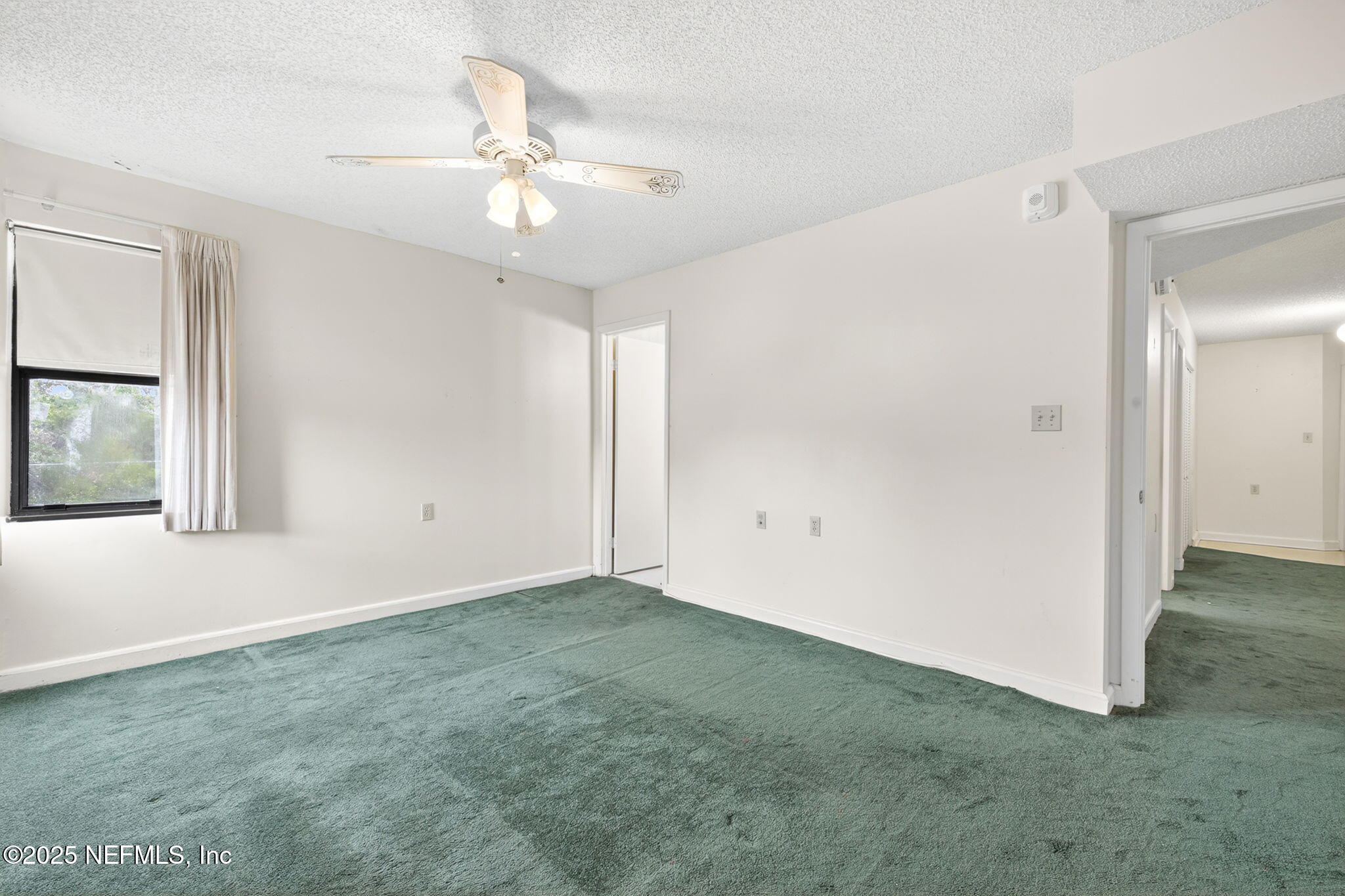 1071 Edgewood Avenue South, Unit 409 Jacksonville, FL 32205 - Photo 18 of 39 a view of an empty room with a window