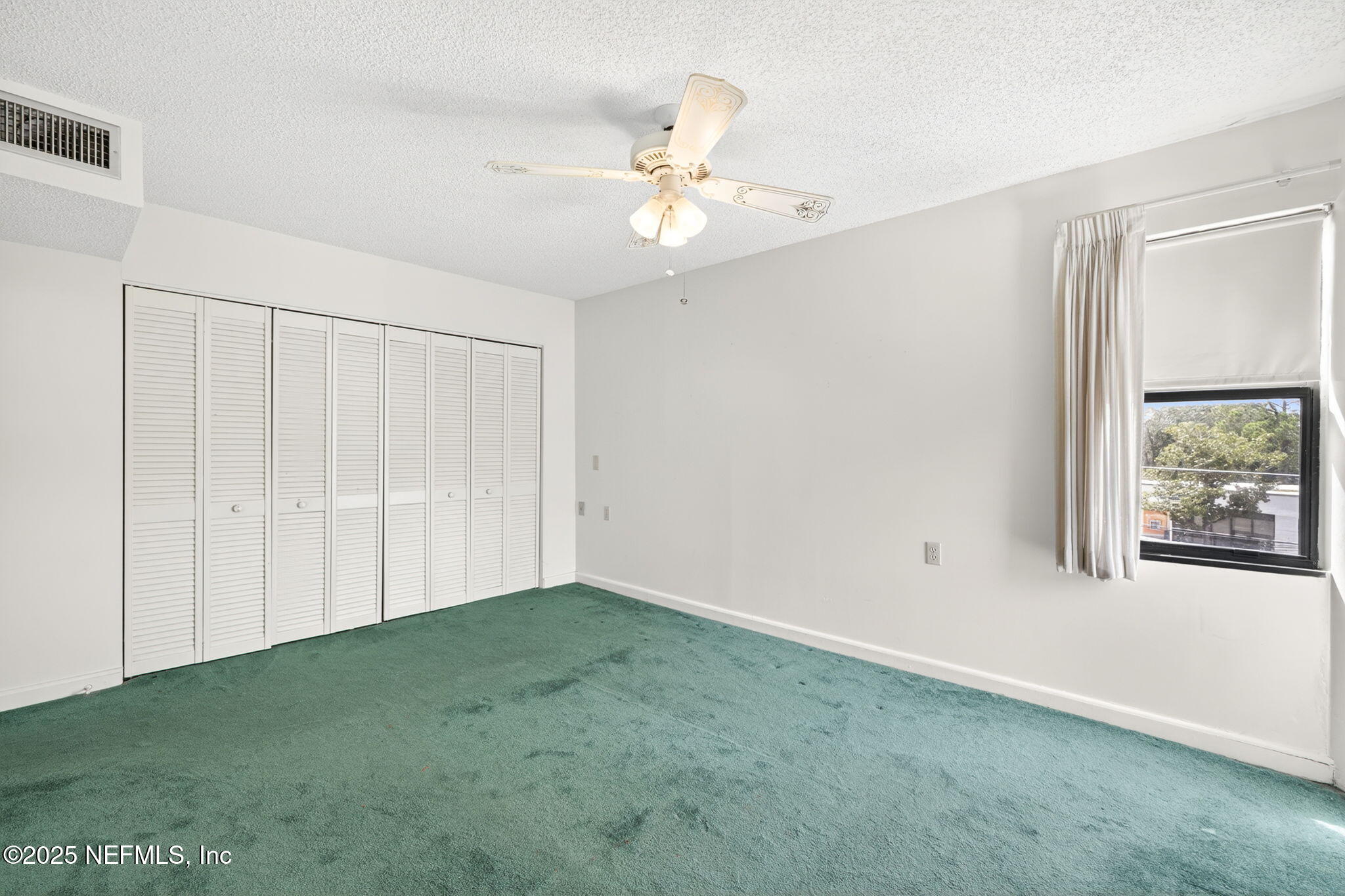 1071 Edgewood Avenue South, Unit 409 Jacksonville, FL 32205 - Photo 20 of 39 a view of an empty room with a window