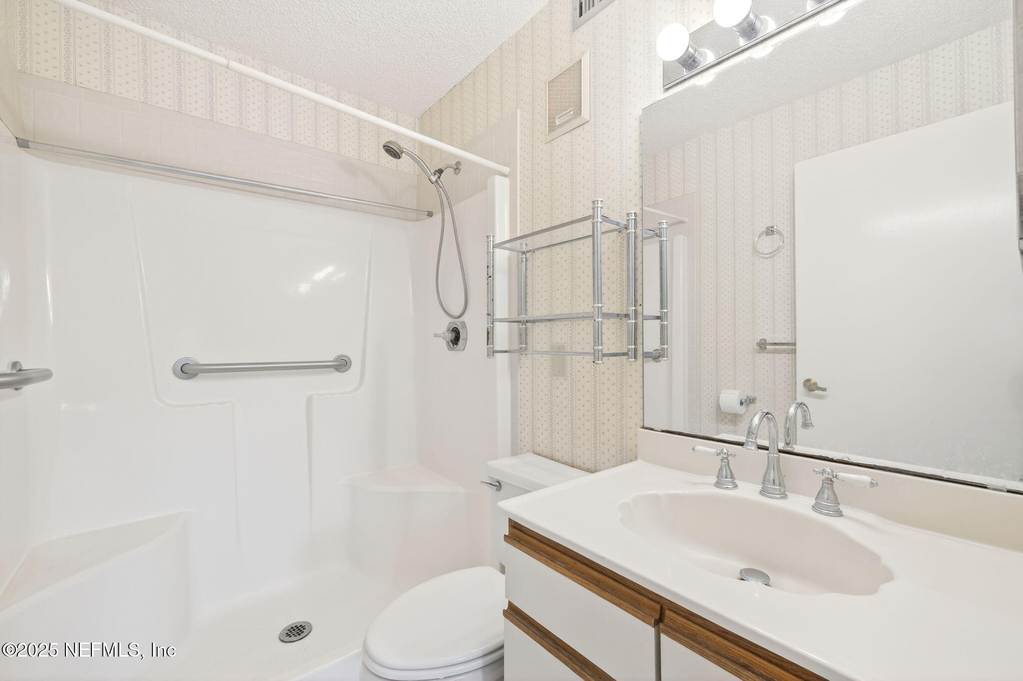 1071 Edgewood Avenue South, Unit 409 Jacksonville, FL 32205 - Photo 21 of 39 a bathroom with a sink toilet and shower