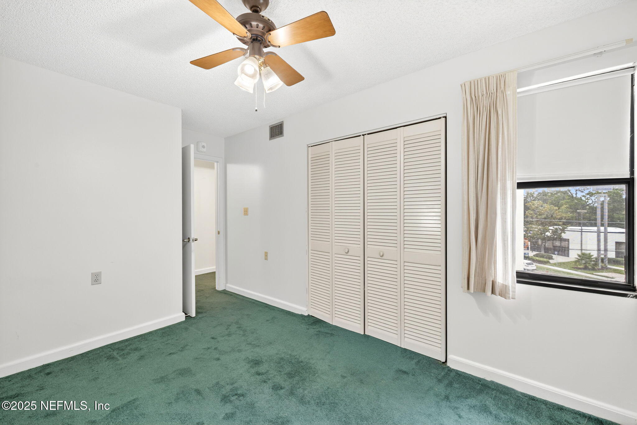 1071 Edgewood Avenue South, Unit 409 Jacksonville, FL 32205 - Photo 22 of 39 a view of an empty room with a window