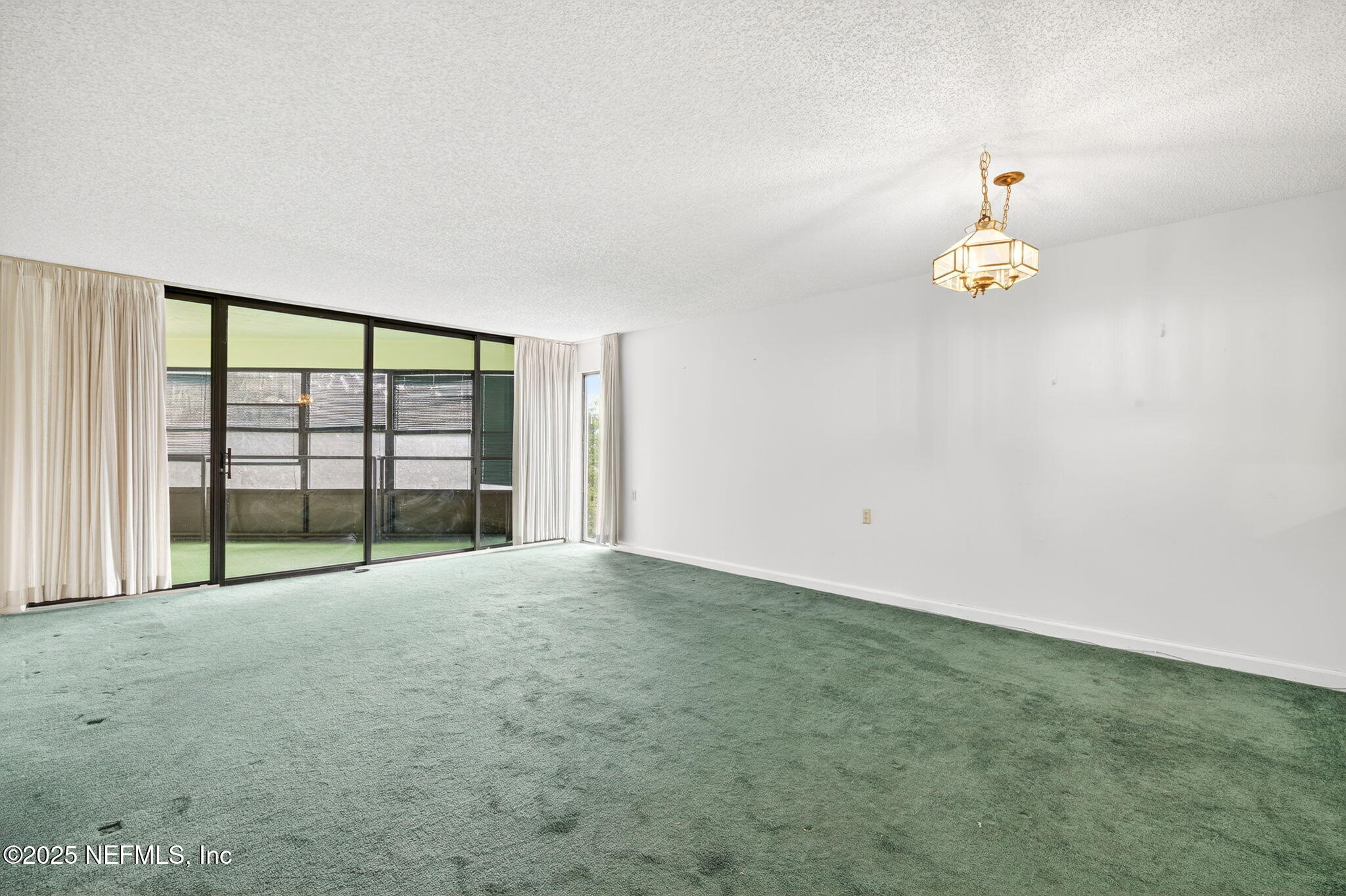 1071 Edgewood Avenue South, Unit 409 Jacksonville, FL 32205 - Photo 8 of 39 a view of an empty room with a window
