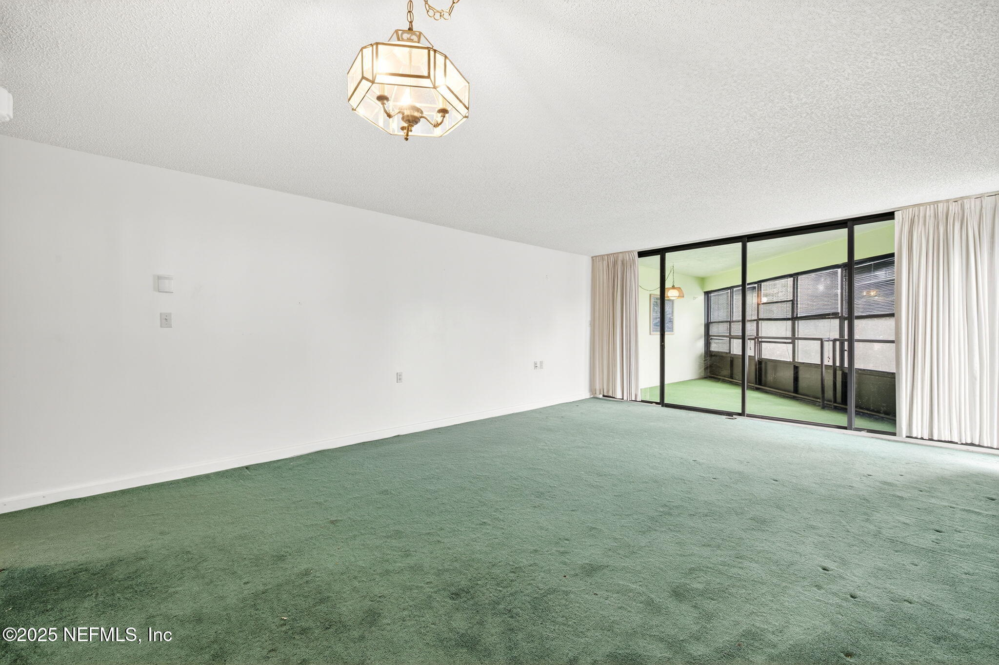 1071 Edgewood Avenue South, Unit 409 Jacksonville, FL 32205 - Photo 10 of 39 a view of an empty room with a window