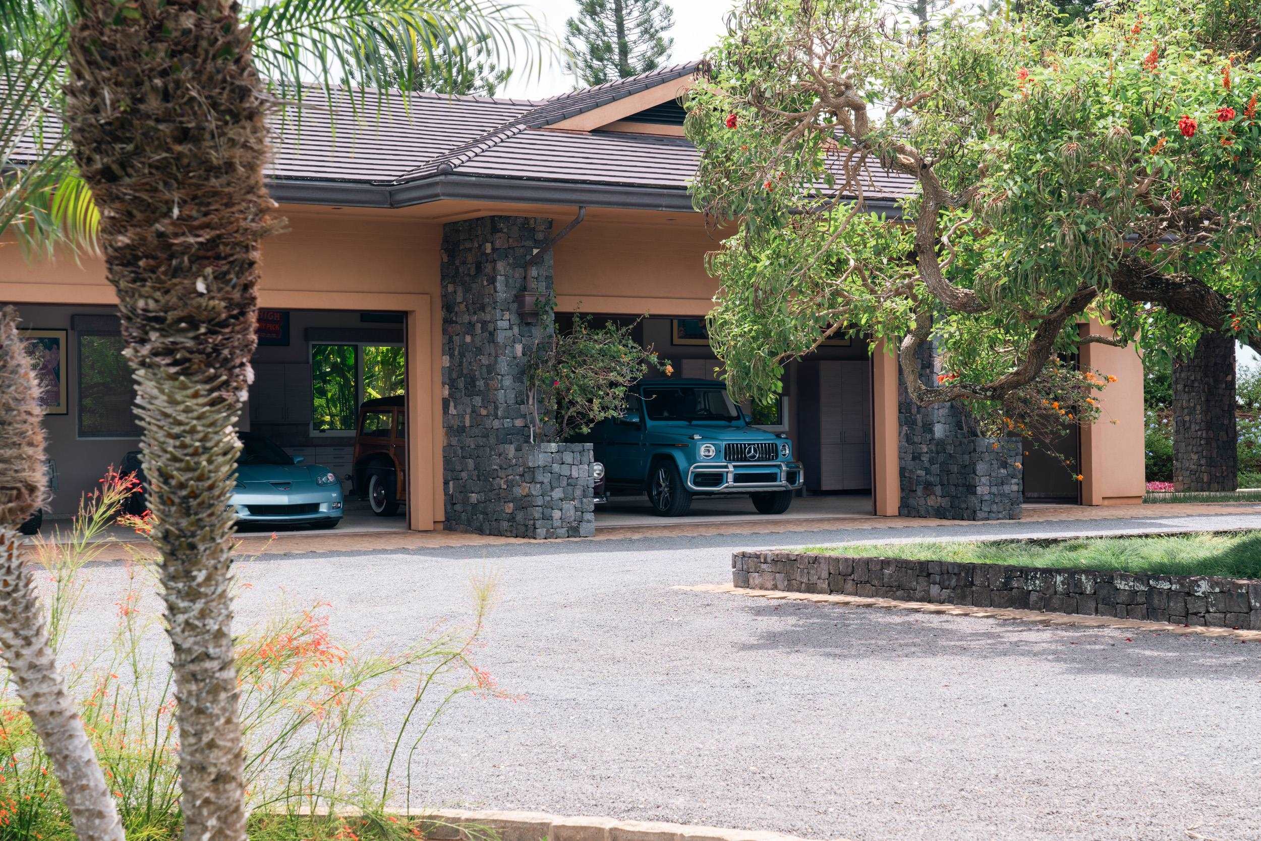 215 Plantation Club Drive Lahaina, HI 96761 - Photo 35 of 50 a front view of a house with a yard and garage