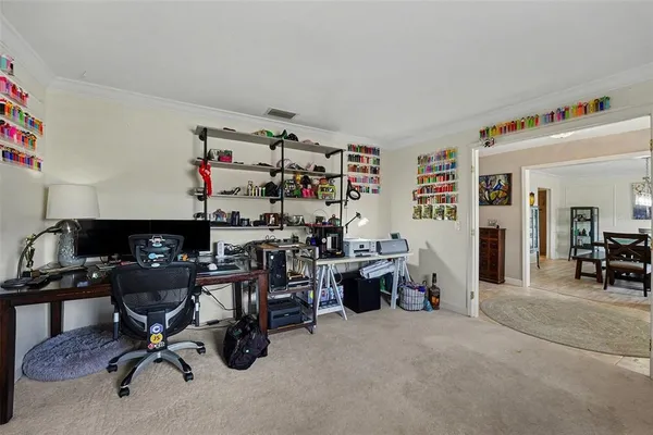 a view of a workspace with furniture