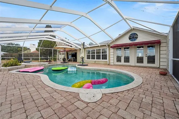 a view of a swimming pool with a porch