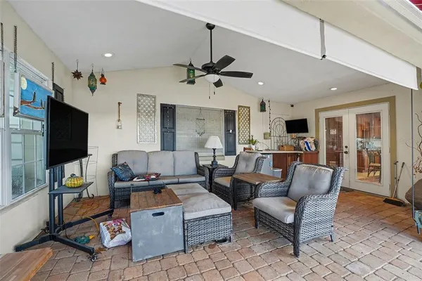 a living room with fireplace furniture and a flat screen tv