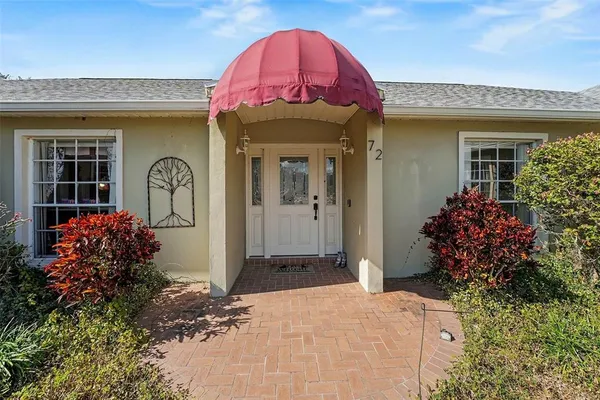 a front view of a house with a porch
