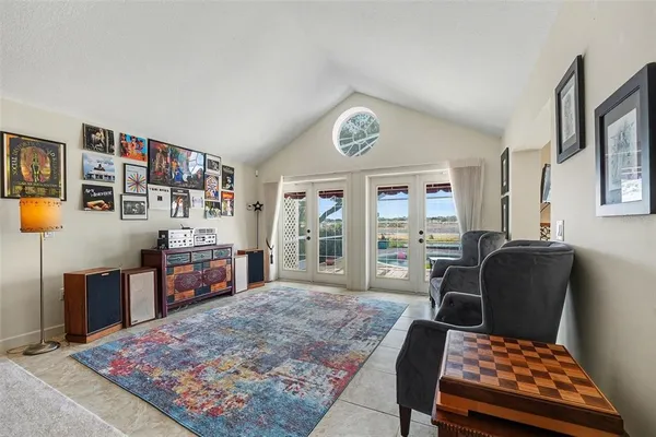 a living room with furniture and a rug