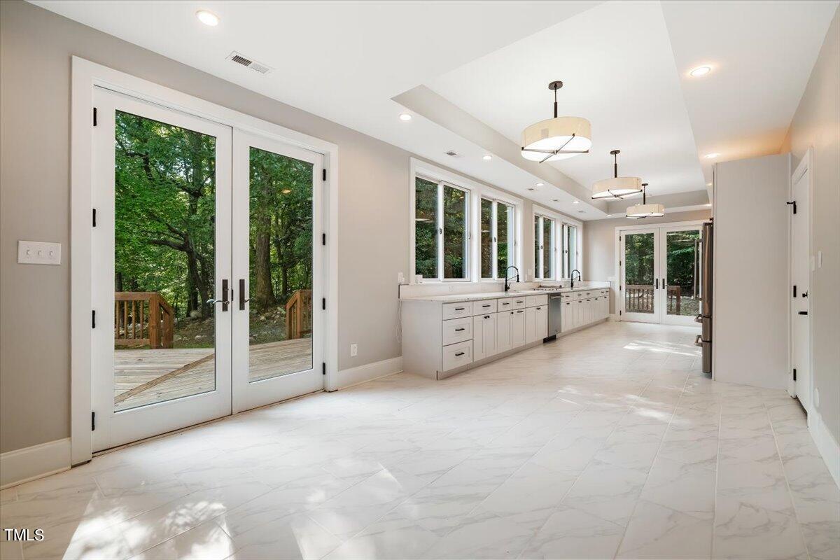 6300 Swallow Cove Lane Raleigh, NC 27614 - Photo 16 of 67 a view of an empty room with a fireplace and a window