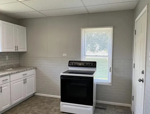 a kitchen with a stove and a sink