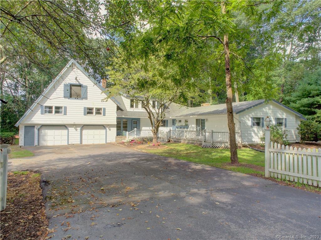 91 Highland Road Mansfield, CT 06250 - Photo 1 of 1 a front view of a house with a garden