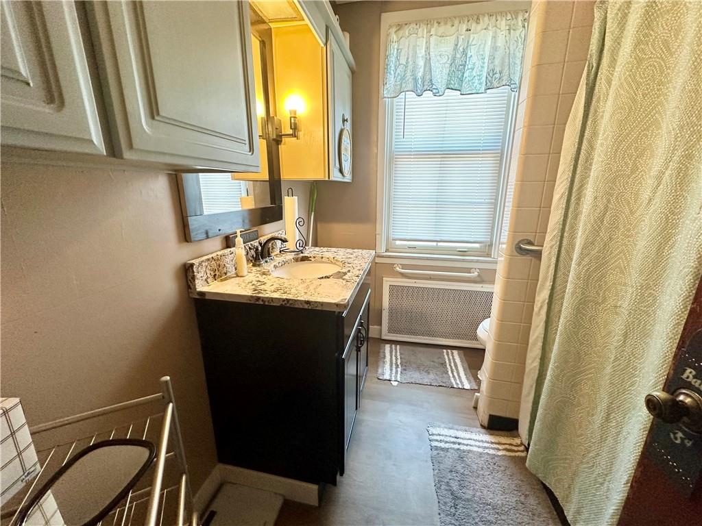 521 West Main Street Rural Valley, PA 16249 - Photo 19 of 39 a bathroom with a sink a toilet and a mirror