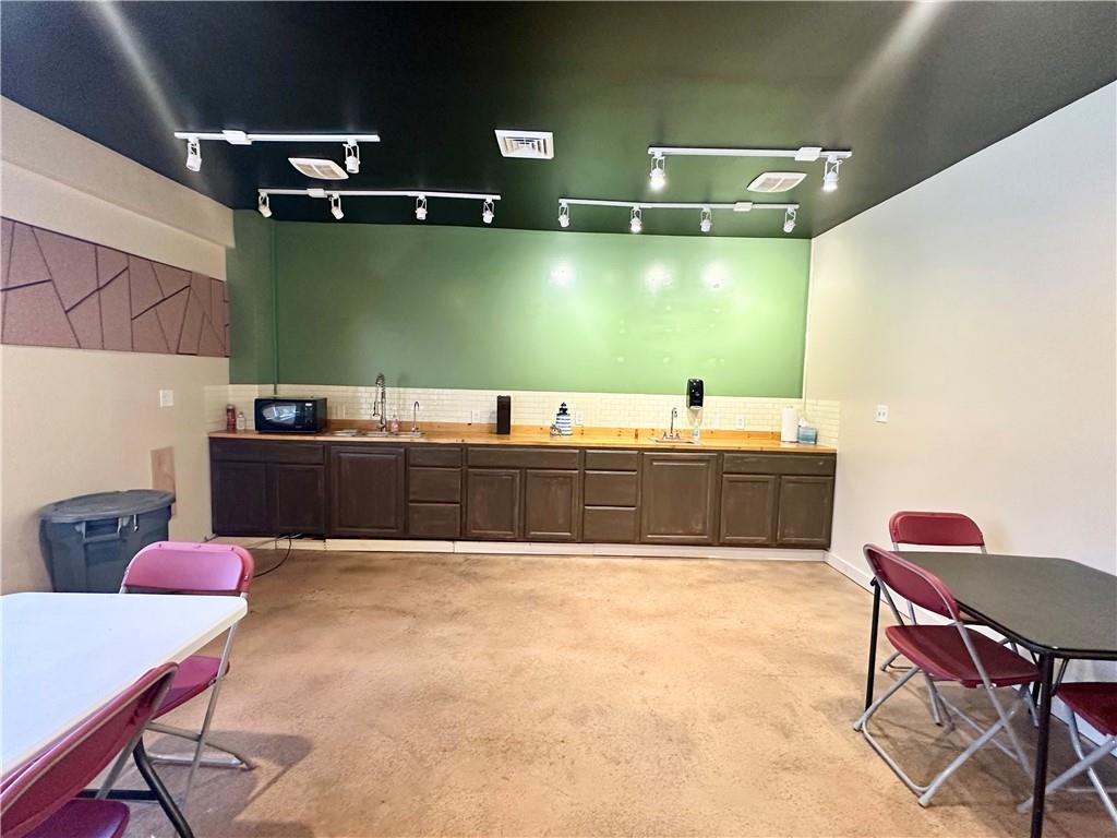 521 West Main Street Rural Valley, PA 16249 - Photo 30 of 39 a room with a table chairs and a workspace