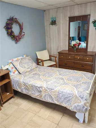a bedroom with a bed and a floor