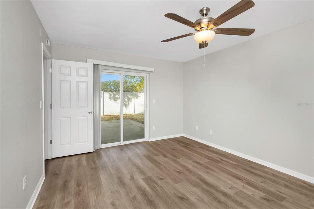 224 Whisper Lake Road Palm Harbor, FL 34683 - Photo 11 of 23 wooden floor in an empty room with a window