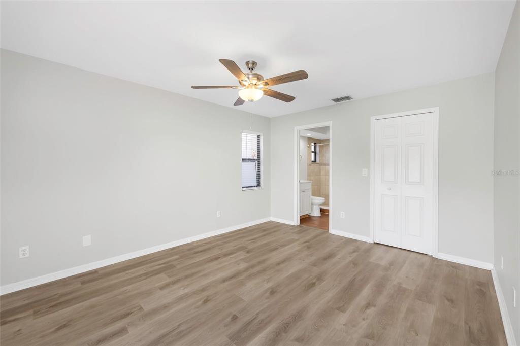 224 Whisper Lake Road Palm Harbor, FL 34683 - Photo 12 of 23 an empty room with fan and a ceiling fan