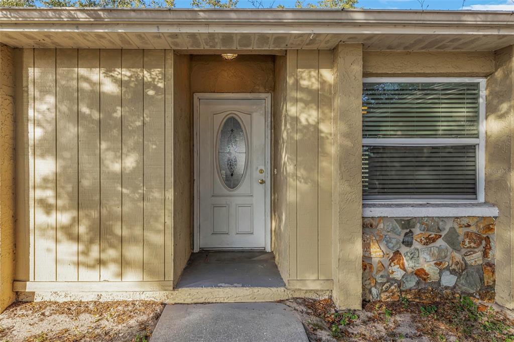 224 Whisper Lake Road Palm Harbor, FL 34683 - Photo 3 of 23 a view of a door and a window