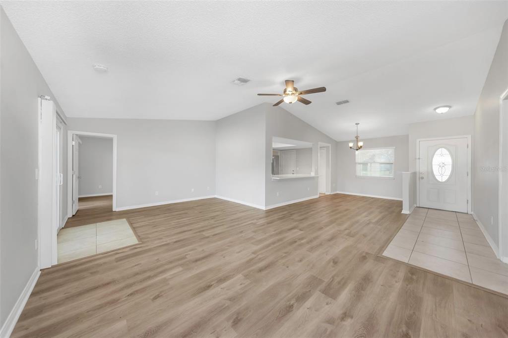 224 Whisper Lake Road Palm Harbor, FL 34683 - Photo 6 of 23 a view of empty room with wooden floor