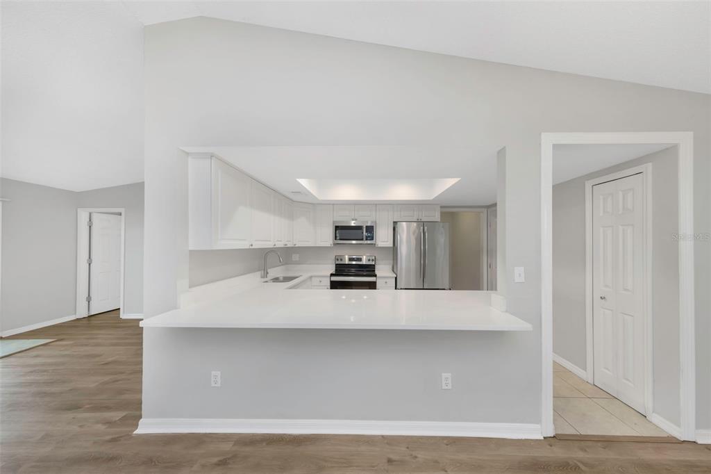 224 Whisper Lake Road Palm Harbor, FL 34683 - Photo 8 of 23 a view of kitchen with microwave and cabinets