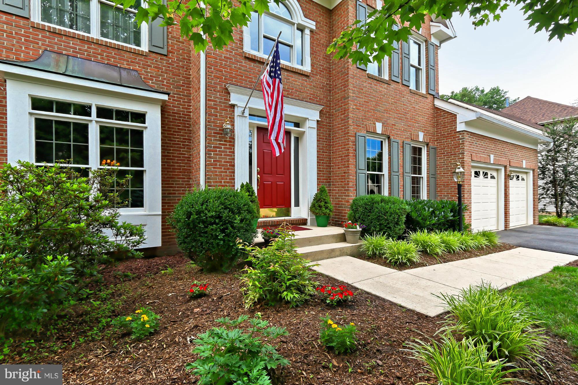 8127 Ridge Creek Way Springfield, VA 22153 - Photo 2 of 30 a view of a building next to a yard