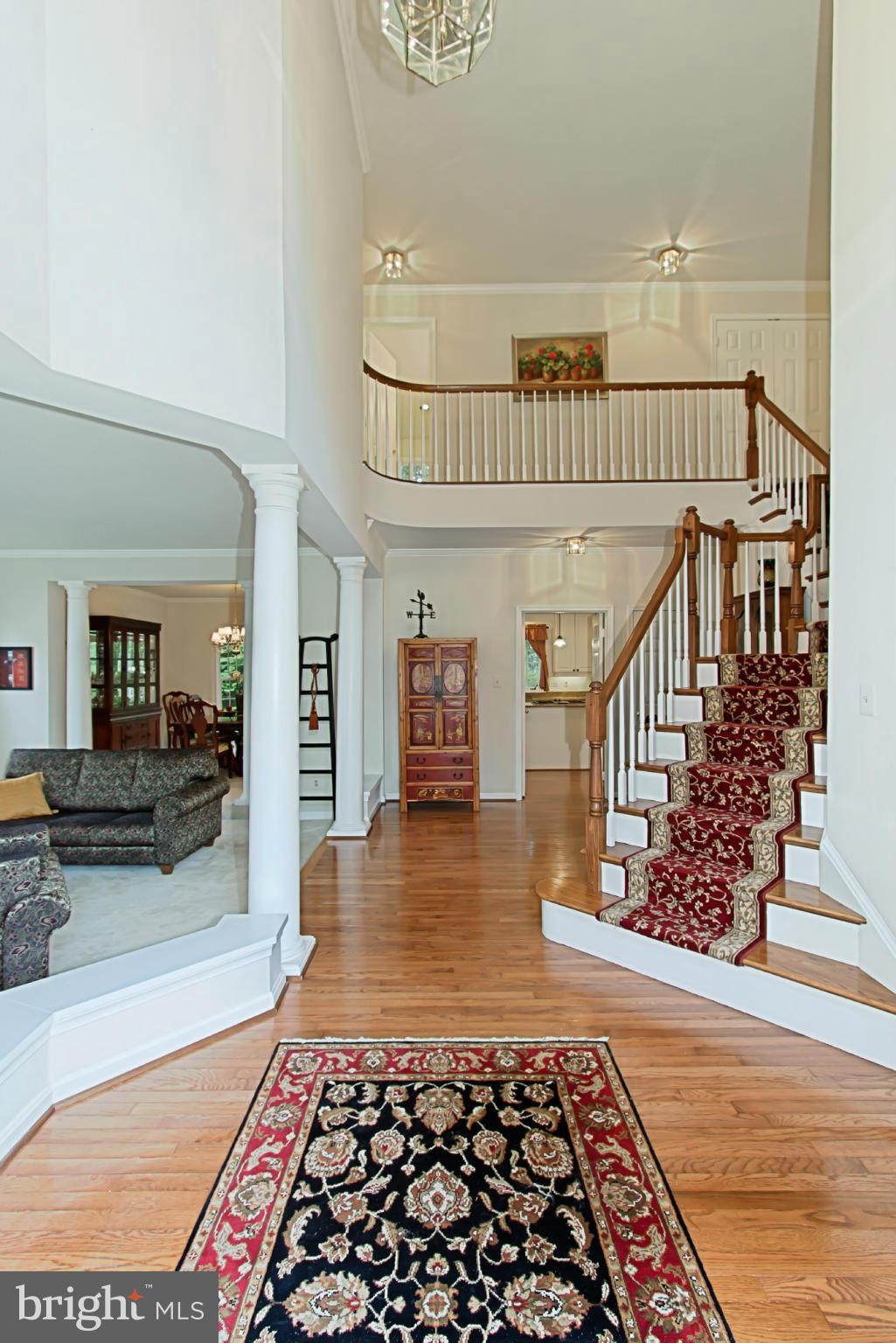 8127 Ridge Creek Way Springfield, VA 22153 - Photo 3 of 30 a view of entryway and hall with wooden floor