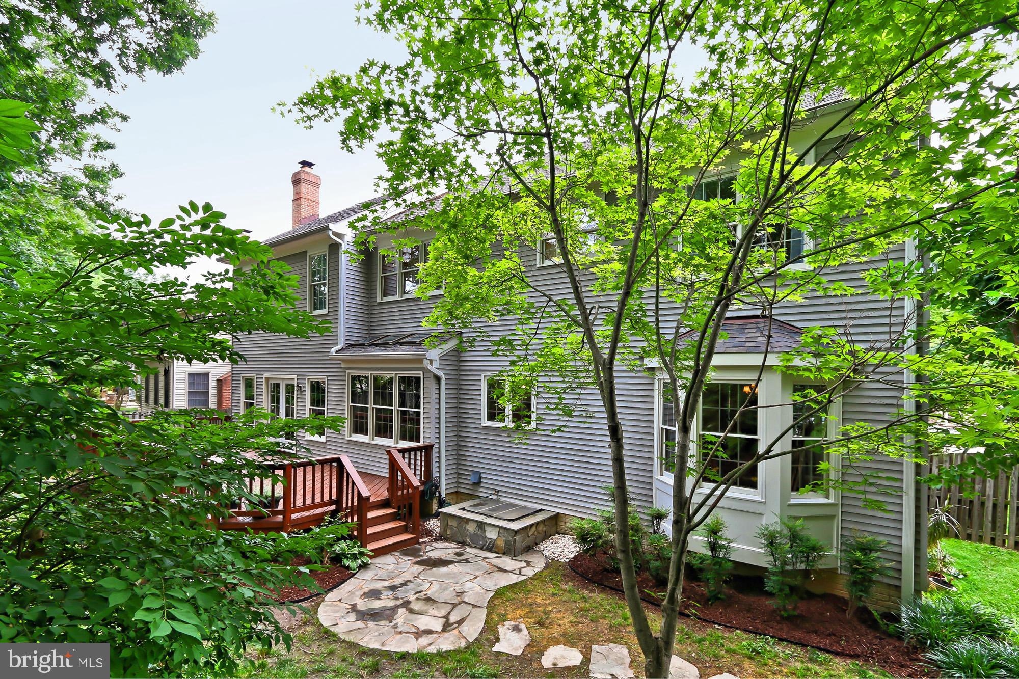 8127 Ridge Creek Way Springfield, VA 22153 - Photo 30 of 30 front view of a house with a garden