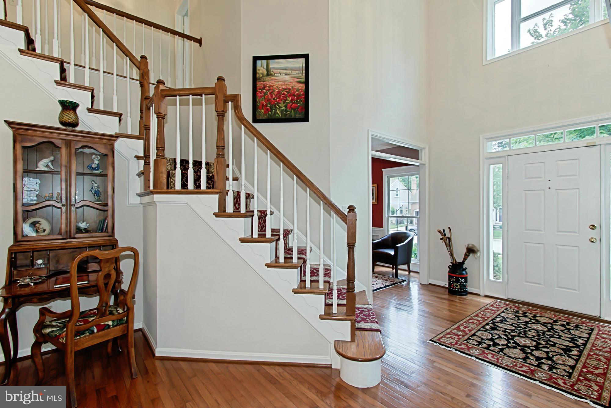 8127 Ridge Creek Way Springfield, VA 22153 - Photo 5 of 30 a view of entryway and hall with wooden floor