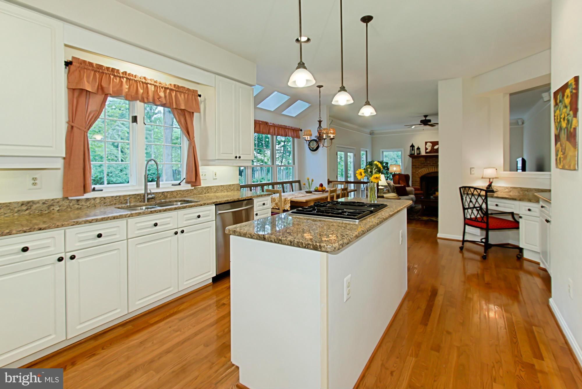8127 Ridge Creek Way Springfield, VA 22153 - Photo 10 of 30 a kitchen with granite countertop a sink a counter space appliances and cabinets