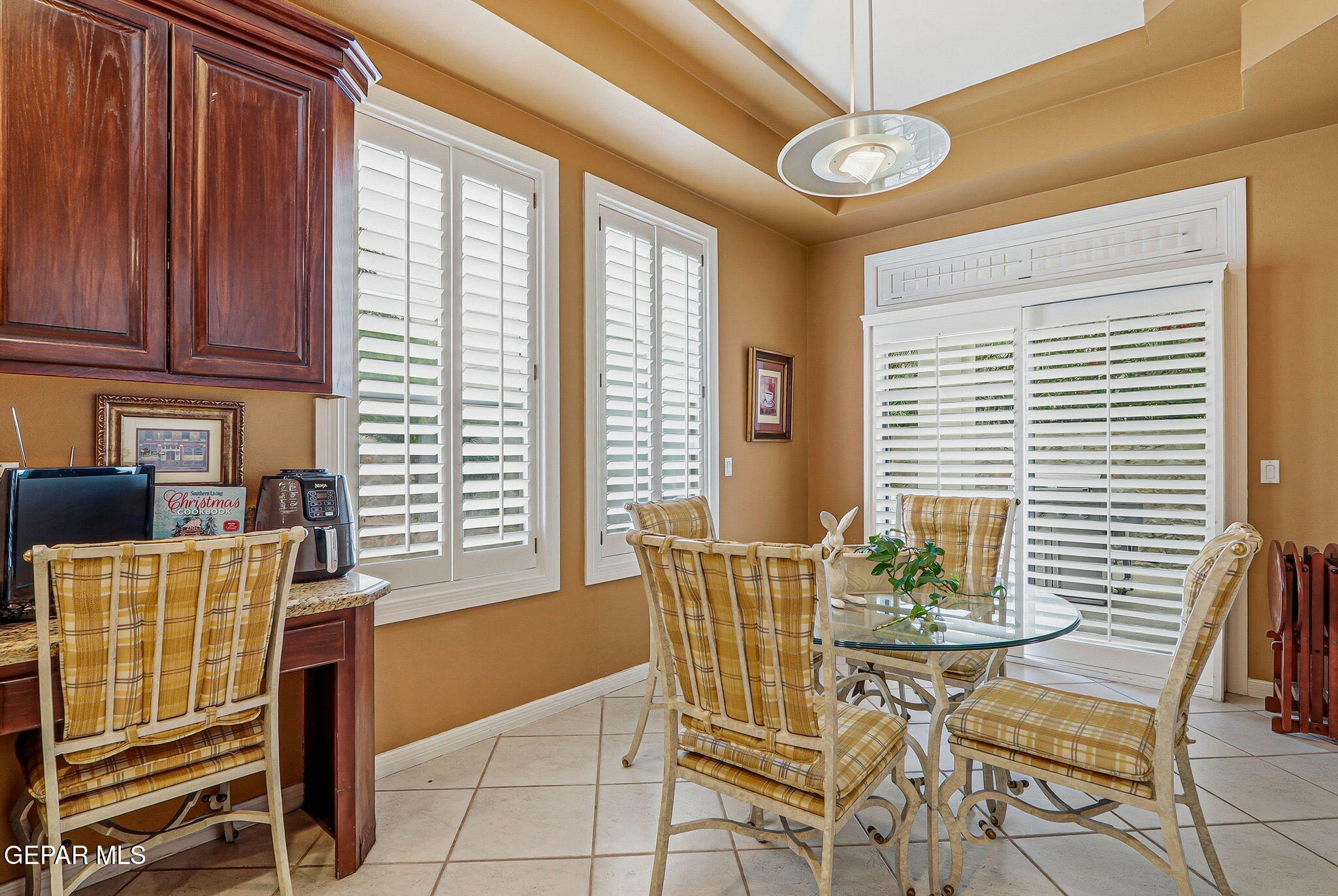 5806 Diamond Point Circle El Paso, TX 79912 - Photo 19 of 61 a view of a dining room with furniture and windows