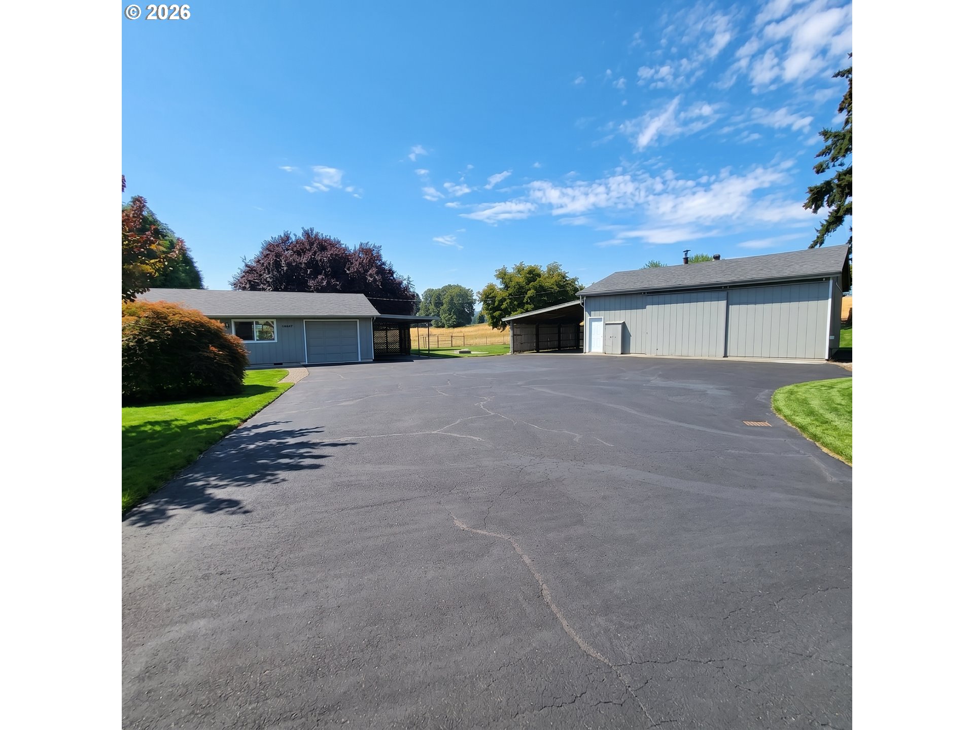 54047 West Lane Road Scappoose, OR 97056 - Photo 16 of 44 a view of a house with backyard and a garden