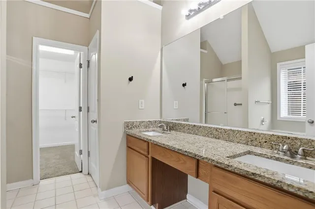 a bathroom with a bathtub next to a window