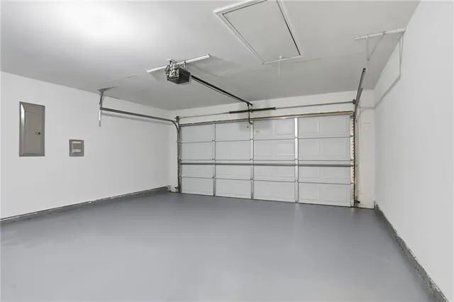 a front view of a house with yard and garage