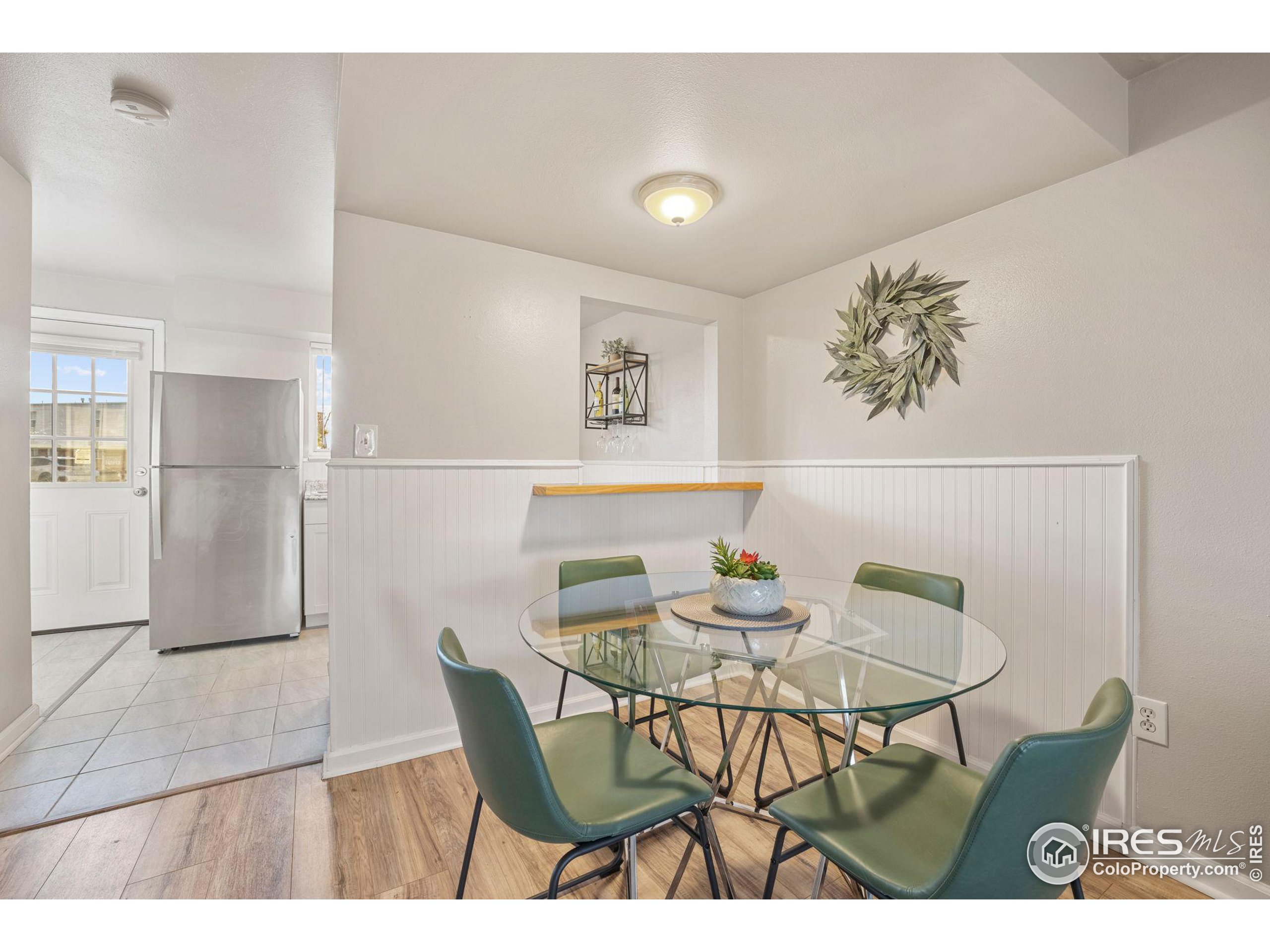 219 Chestnut Street Windsor, CO 80550 - Photo 10 of 23 a view of a dining room with furniture