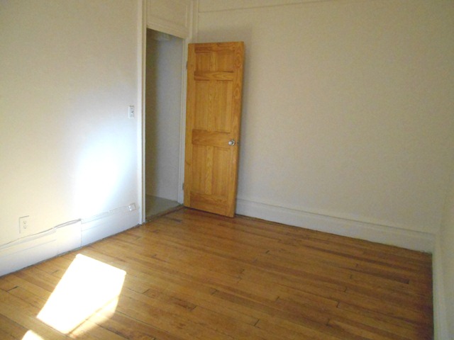 170-172 Spring Street, Unit 7 Manhattan, NY 10012 - Photo 5 of 8 an empty room with closet