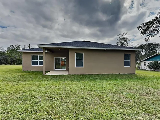 a backyard of a house with lots of green space