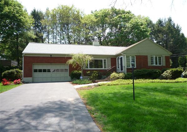35 Webster Road Lexington, MA 02421 - Photo 1 of 1 a front view of a house with a yard and trees