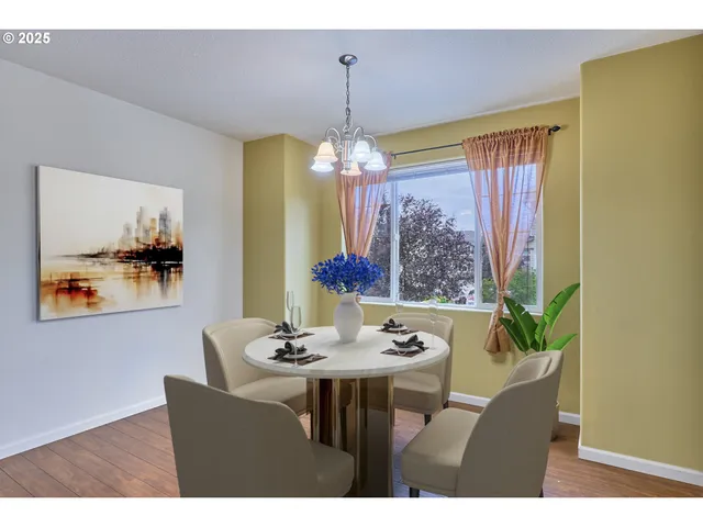 a dining room with furniture and window