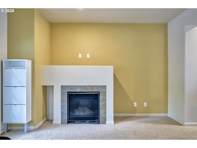 a view of a livingroom with a fireplace