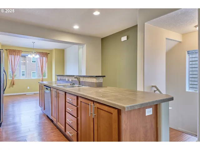 a bathroom with a granite countertop sink a mirror and a bathtub