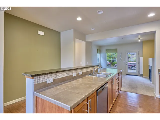 a bathroom with a sink a granite counter top and a mirror